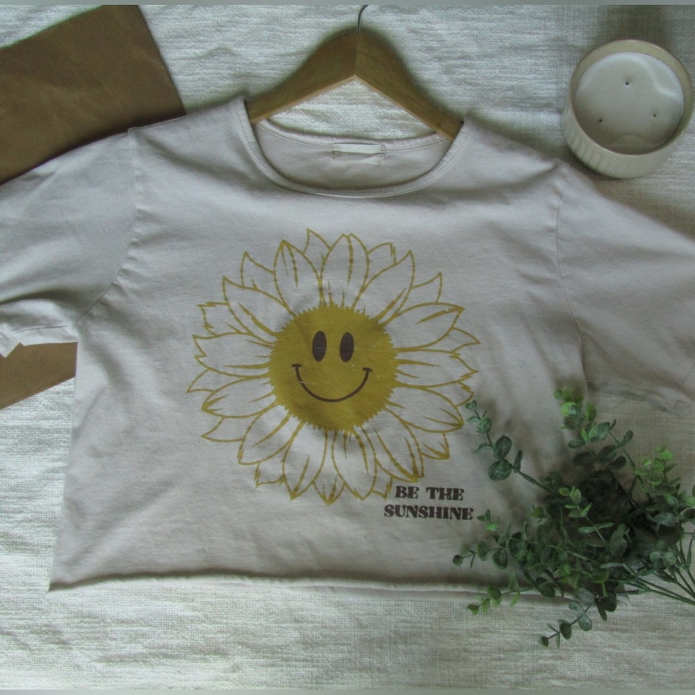 Cream Altar’d State cropped, graphic tee in the size XS.